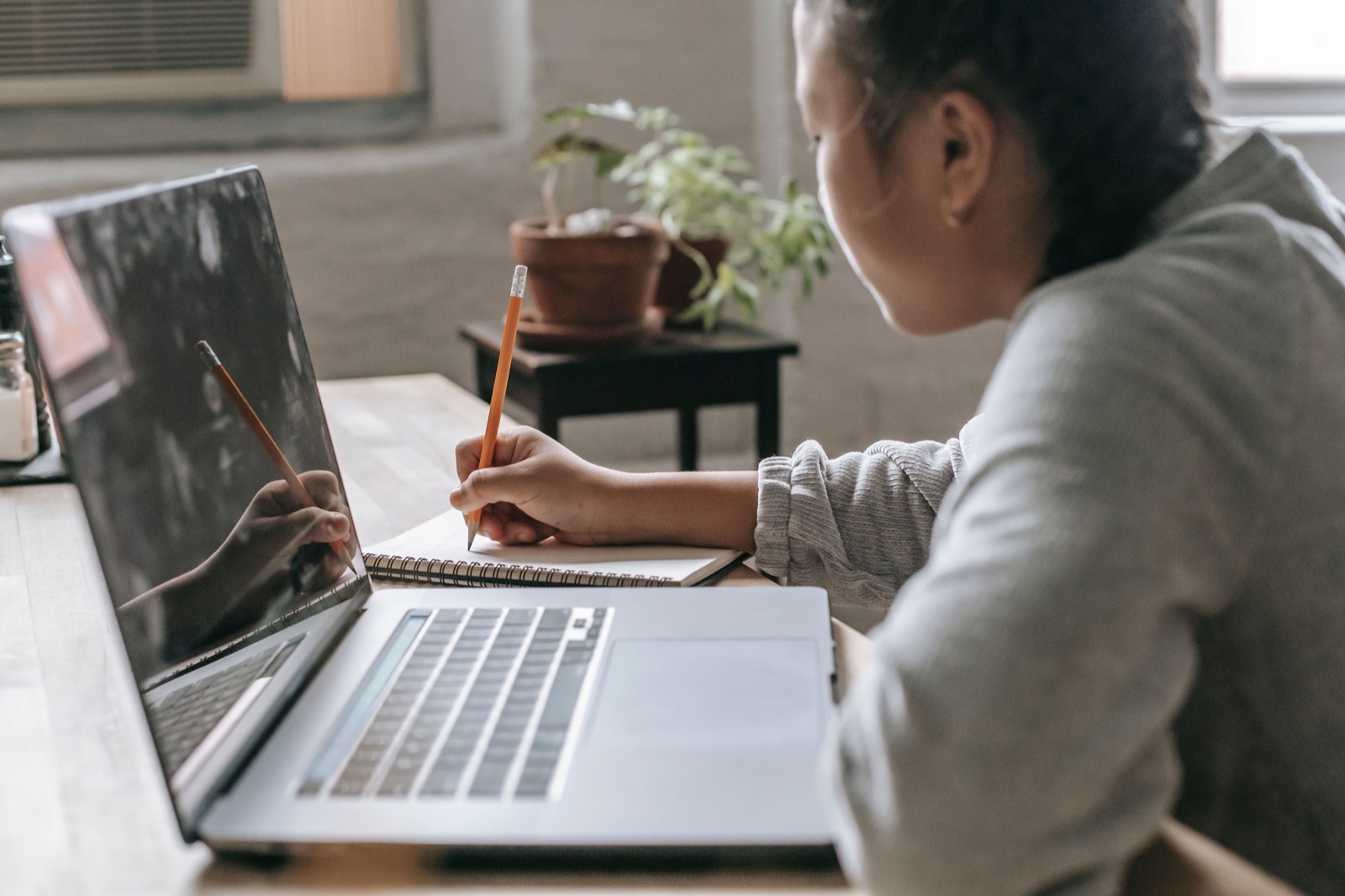 Student studying online at a laptop